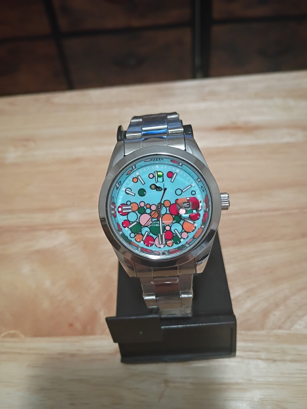 Stainless Steel Wristwatch with Turquoise Dial and Colorful Accents